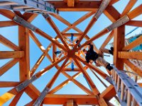 Bill Gilmore, a carpenter with Caddis Construction, tries to align the walls of the steeple they are constructing on the ground, to be hoisted to the top of the Grace Episcopal Church, in New Bedford.   PETER PEREIRA/THE STANDARD-TIMES/SCMG